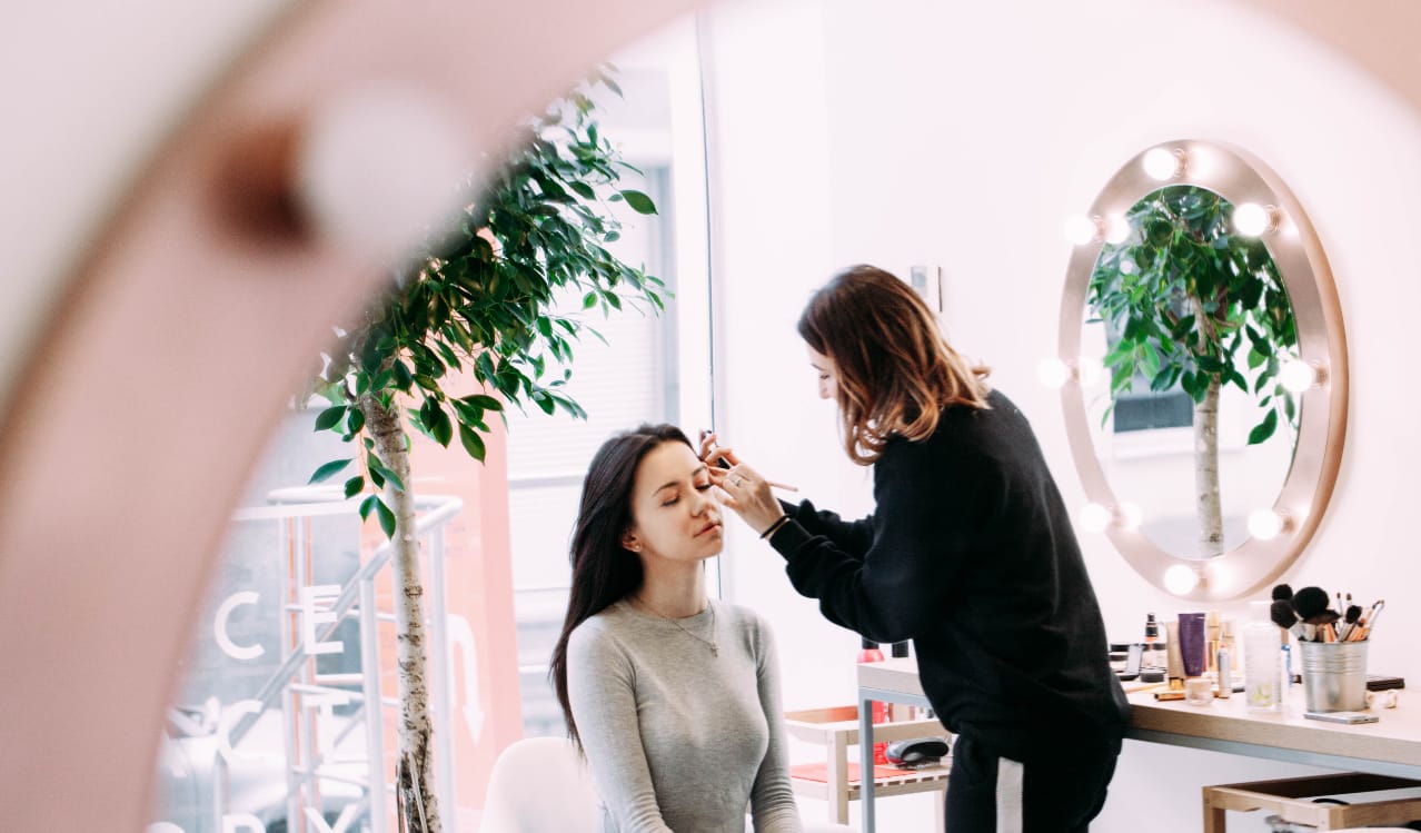 Beauty college students in a professional training environment — cosmetology school programs at Bela Beauty College